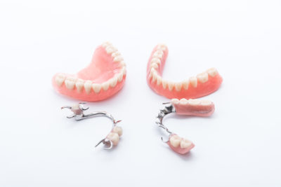 Set of dentures on white background .